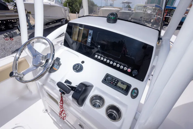 Slide: The Image of 2015 Sportsman Heritage 211 Center Console dashboard with steering wheel and navigation controls. - 27