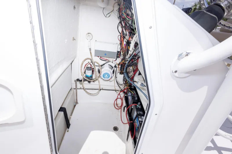 Slide: The Image of 2015 Sportsman Heritage 211 Center Console wiring and battery compartment. - 31