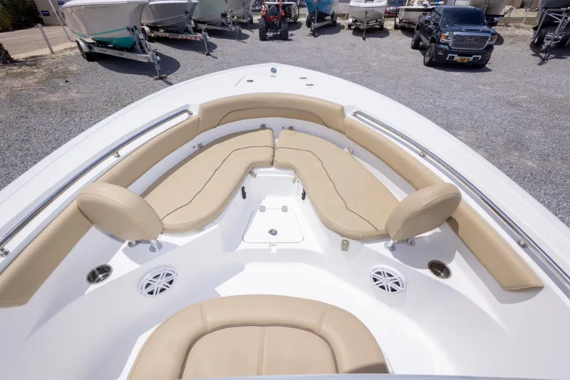 Slide: The Image of 2015 Sportsman Heritage 211 Center Console boat with beige seating and spacious deck. - 32