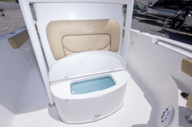 Slide: The Image of 2015 Sportsman Heritage 211 Center Console boat with cushioned seating and storage compartment. - 33