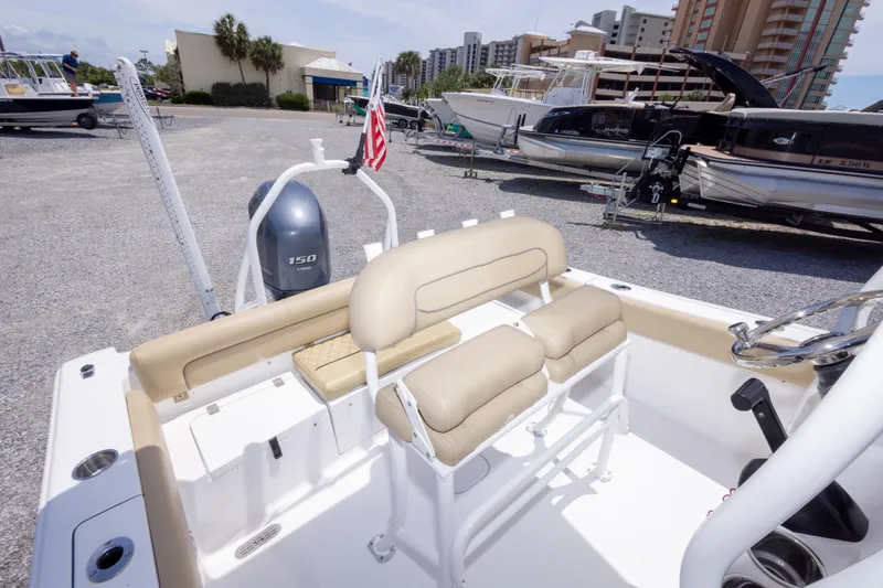 Slide: The Image of 2015 Sportsman Heritage 211 Center Console boat with beige seating and Yamaha 150 engine. - 39
