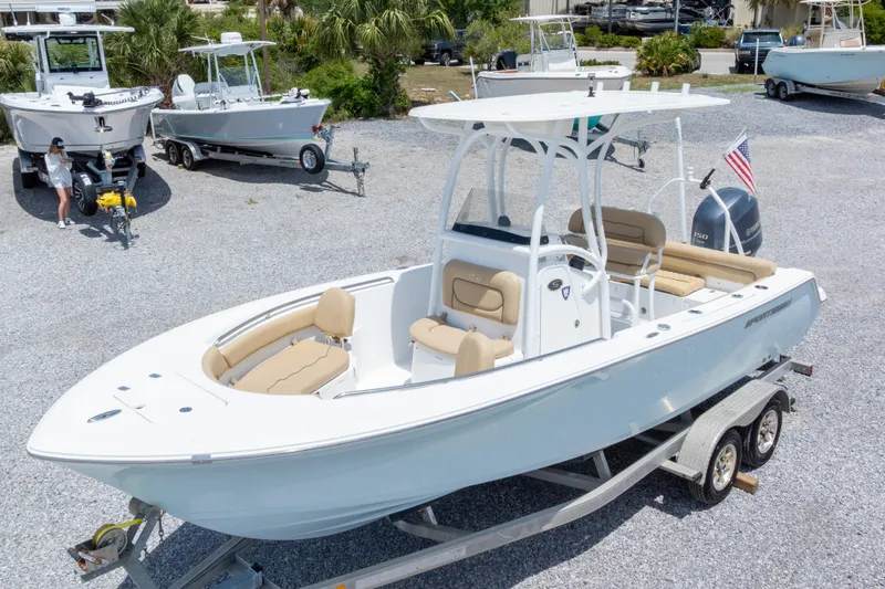 Slide: The Image of 2015 Sportsman Heritage 211 Center Console boat on trailer, parked outdoors. - 4