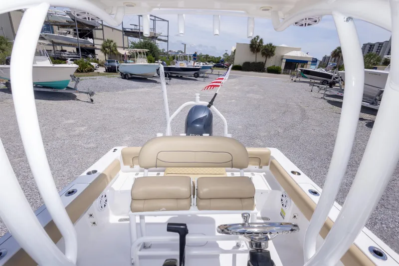 Slide: The Image of 2015 Sportsman Heritage 211 Center Console boat interior at a marina. - 40
