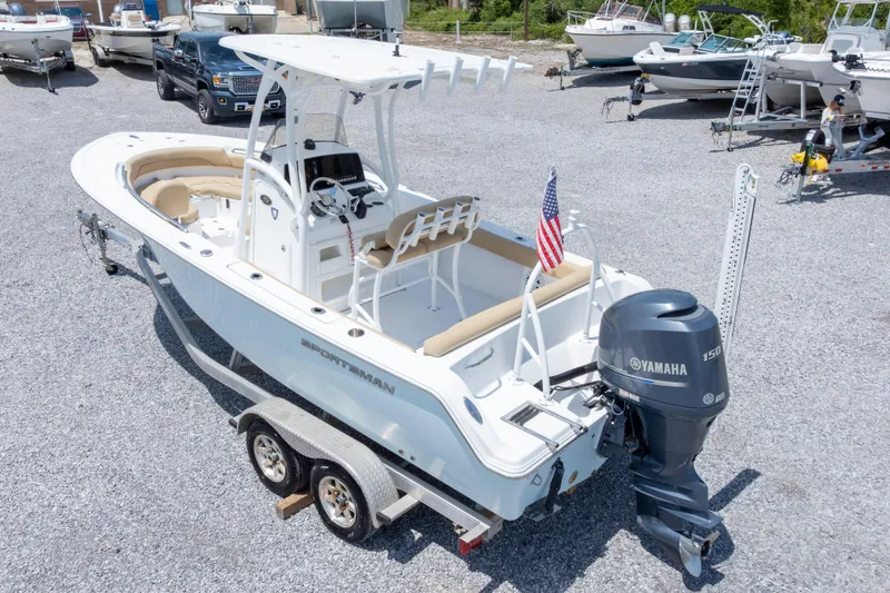 Slide: The Image of 2015 Sportsman Heritage 211 Center Console boat with Yamaha 150 engine on trailer. - 46