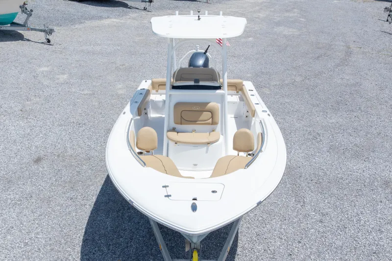 Slide: The Image of 2015 Sportsman Heritage 211 Center Console boat on gravel lot, aerial view. - 5