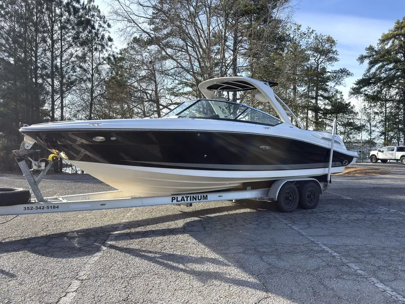 The Image of 2008 Sea Ray 270 SLX boat on trailer parked outdoors. - 0