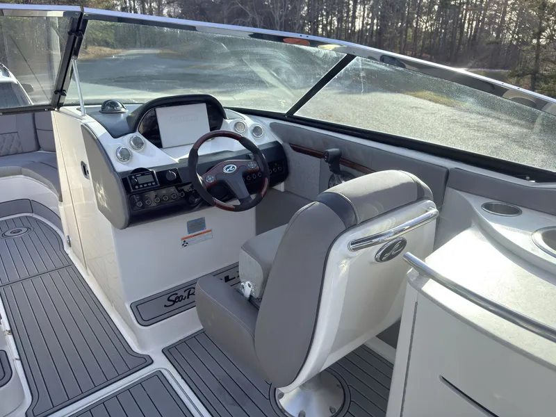 Slide: The Image of Interior of a 2008 Sea Ray 270 SLX boat with helm station. - 10