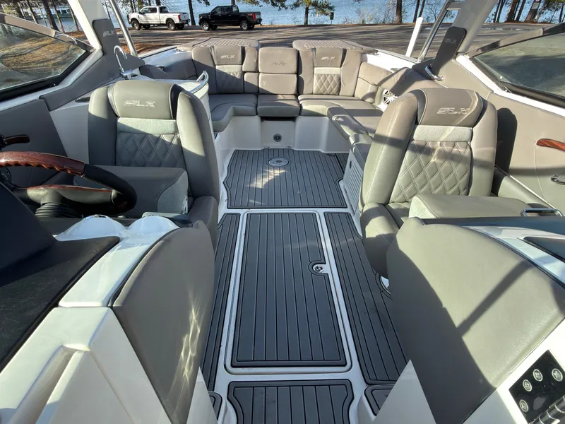 Slide: The Image of Interior of a 2008 Sea Ray 270 SLX boat with luxurious seating. - 16