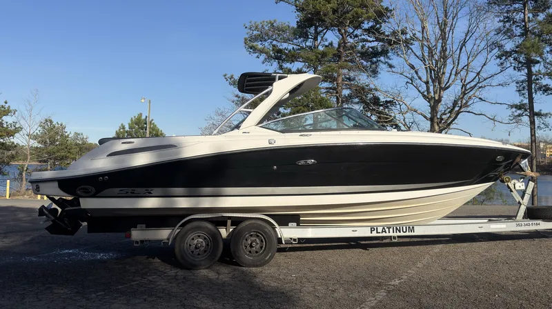 Slide: The Image of 2008 Sea Ray 270 SLX boat on trailer outdoors. - 2