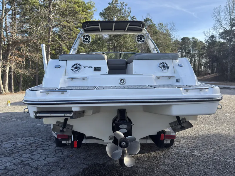 Slide: The Image of Rear view of a 2008 Sea Ray 270 SLX boat in a parking lot. - 4