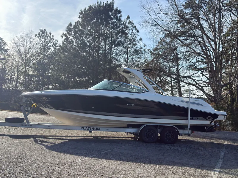 Slide: The Image of 2008 Sea Ray 270 SLX boat parked on trailer outdoors. - 6