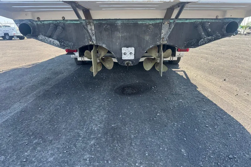 Slide: The Image of Rear view of a 2006 Strike 29 CC boat showing dual propellers and exhaust outlets. - 11