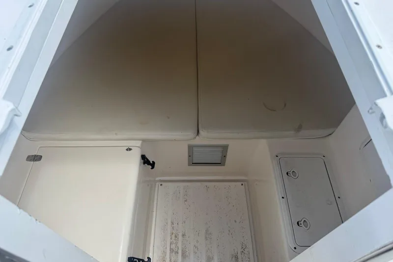 Slide: The Image of Interior cabin of a 2006 Strike 29 CC boat, featuring storage compartments. - 15