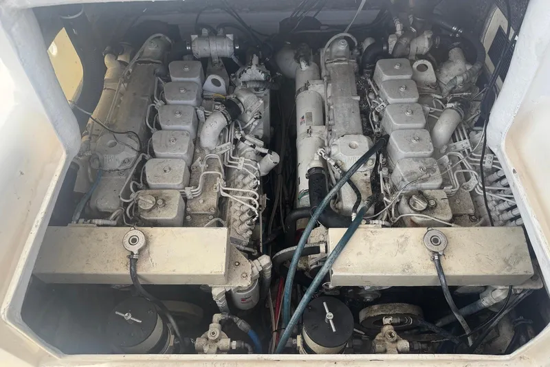 Slide: The Image of Engine compartment of a 2006 Strike 29 CC boat, showcasing dual engines and mechanical components. - 16