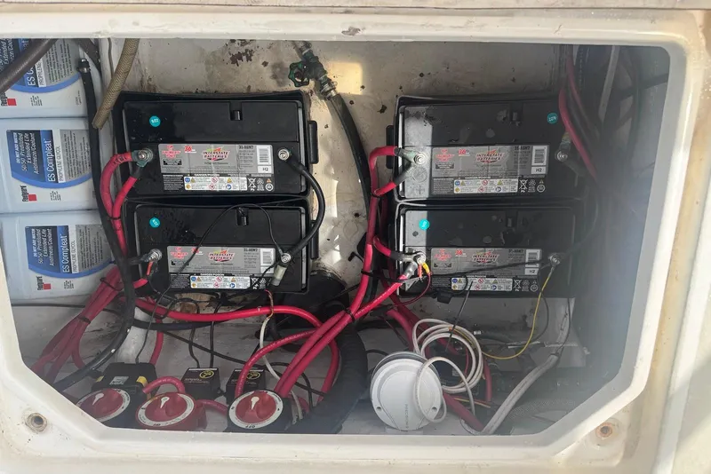 Slide: The Image of Battery compartment of a 2006 Strike 29 CC boat with wiring and switches. - 18