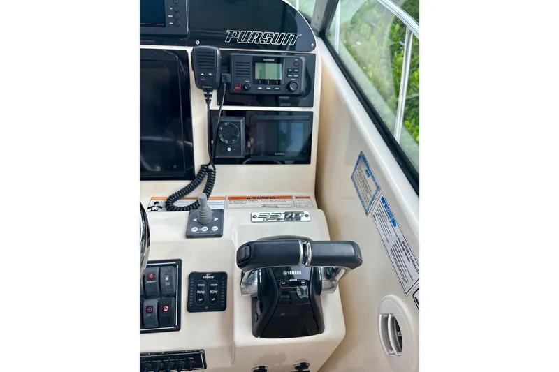 Slide: The Image of 2007 Pursuit 3370 Offshore boat cockpit with Yamaha controls and Garmin electronics. - 13