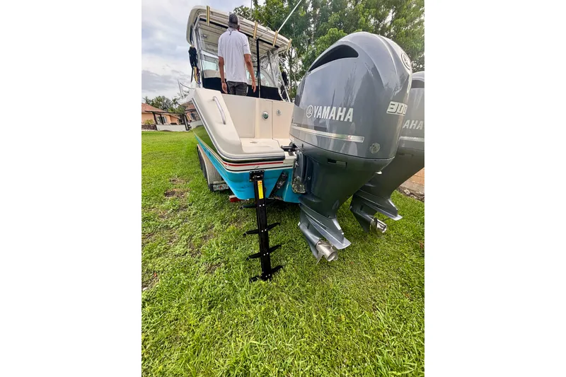 Slide: The Image of 2007 Pursuit 3370 Offshore boat with Yamaha engines on grassy area. - 15