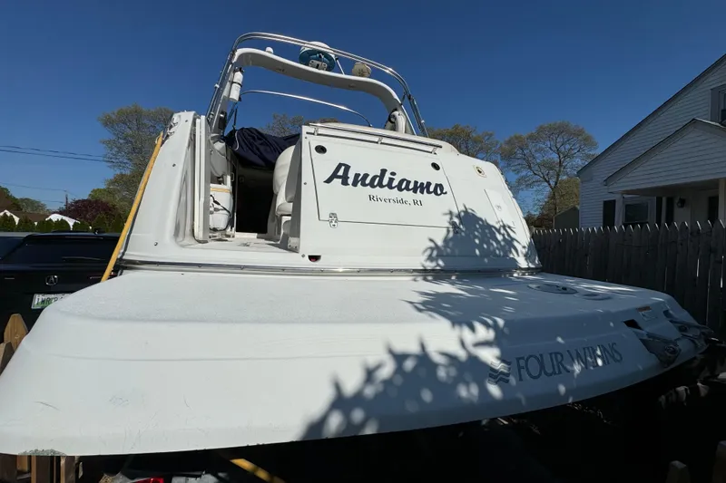 Slide: The Image of 2004 Four Winns 268 Vista boat named "Andiamo" in Riverside, RI, parked outdoors. - 12