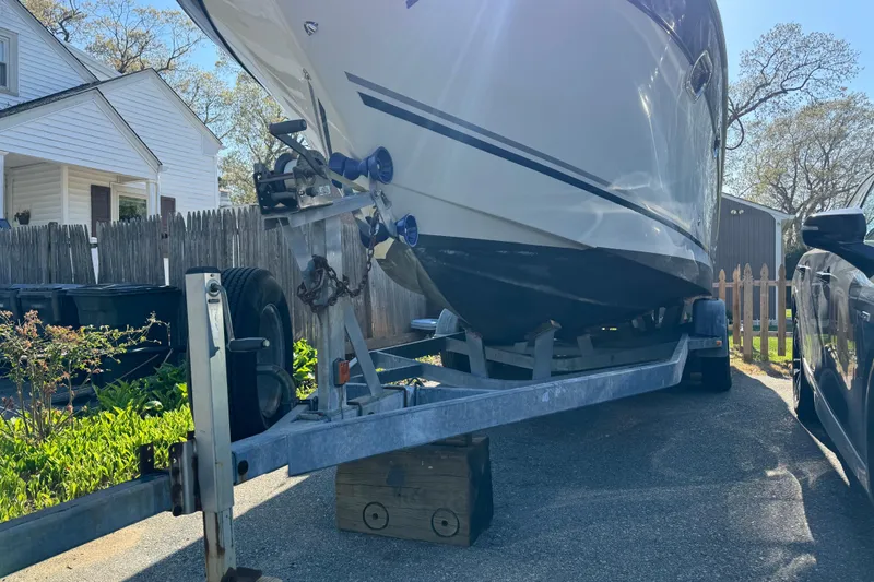 Slide: The Image of 2004 Four Winns 268 Vista boat on trailer in residential driveway. - 3
