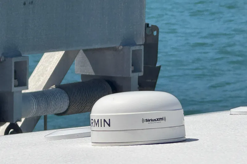 Slide: The Image of Garmin SiriusXM antenna on 2023 Sea Hunt Gamefish 27 boat, with ocean background. - 13