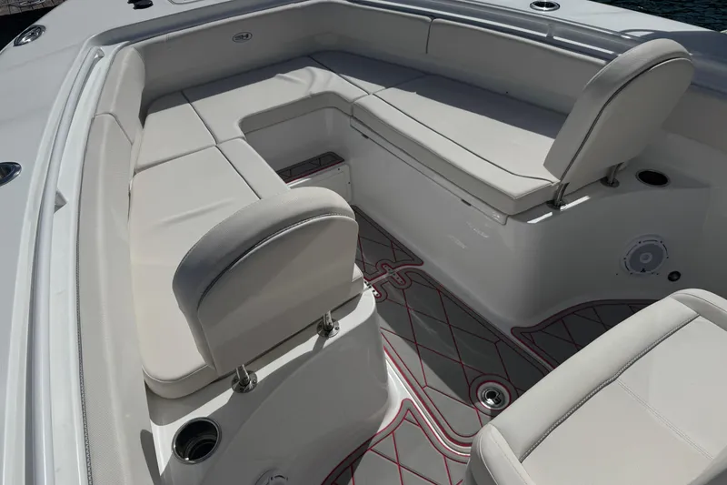 Slide: The Image of 2023 Sea Hunt Gamefish 27 Forward Seating with luxurious white upholstery and spacious layout. - 16