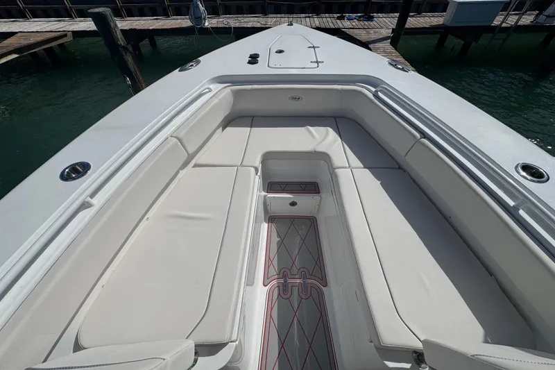 Slide: The Image of 2023 Sea Hunt Gamefish 27 Forward Seating, spacious deck with cushioned seating. - 17
