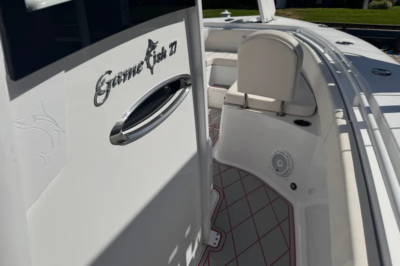 Slide: The Image of 2023 Sea Hunt Gamefish 27 Forward Seating boat interior with sleek design and comfortable seating. - 18