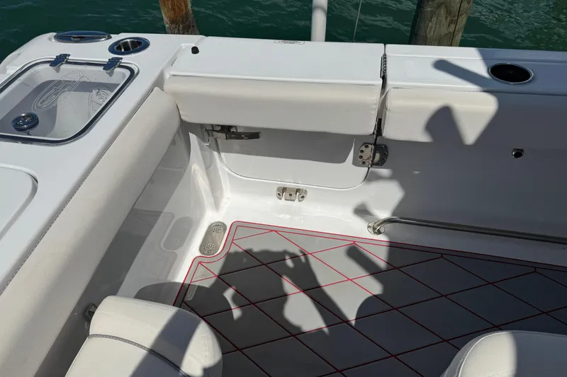 Slide: The Image of 2023 Sea Hunt Gamefish 27 boat interior with forward seating and storage compartments. - 6