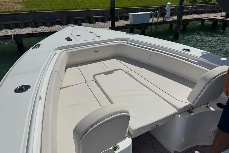 Slide: The Image of 2023 Sea Hunt Gamefish 27 Forward Seating boat with spacious white cushioned seating. - 9