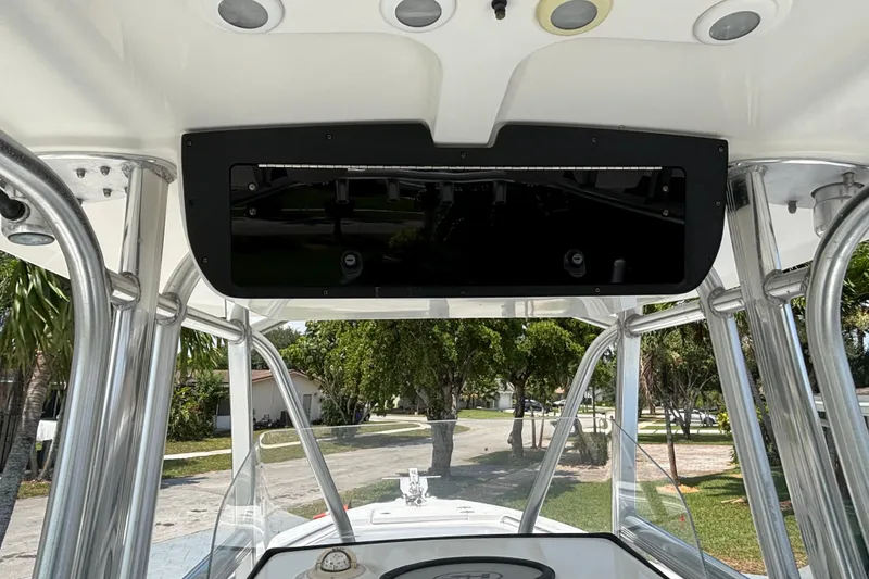 Slide: The Image of 2011 Sea Hunt Gamefish 25 boat interior with T-top and console view. - 7