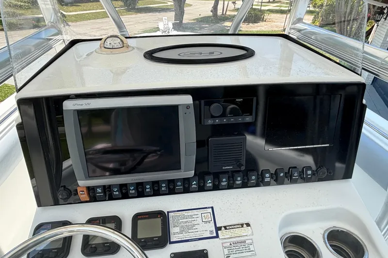 Slide: The Image of 2011 Sea Hunt Gamefish 25 dashboard with GPS and control panel. - 8