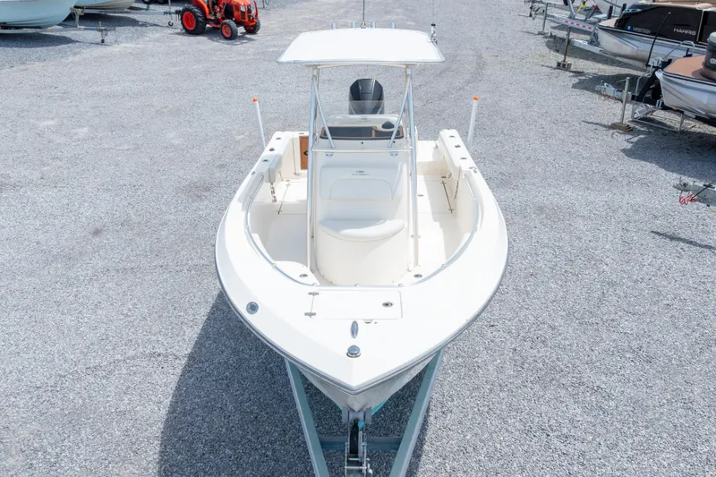The Image of 2022 Cobia 237 Center Console boat on trailer, displayed outdoors. - 0