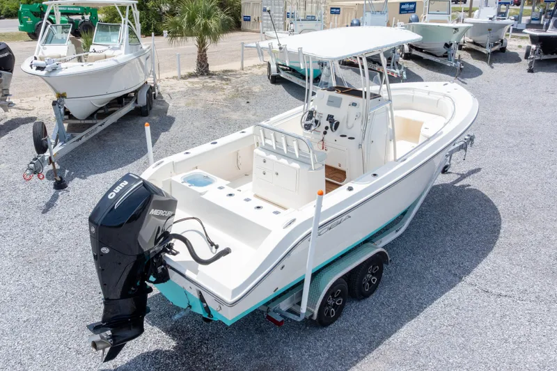 Slide: The Image of 2022 Cobia 237 Center Console boat with Mercury outboard engine on trailer. - 11