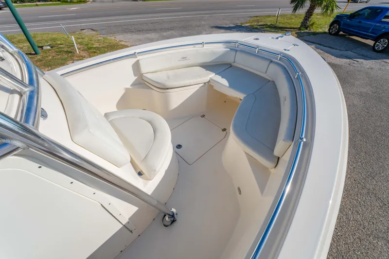 Slide: The Image of 2022 Cobia 237 Center Console boat with spacious seating and sleek design. - 31