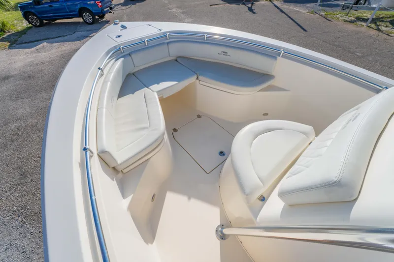 Slide: The Image of 2022 Cobia 237 Center Console boat with spacious seating and sleek design. - 32