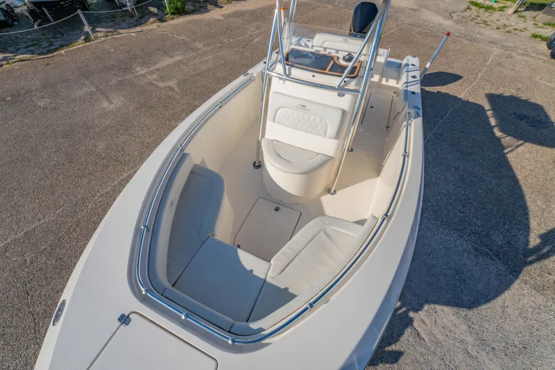 Slide: The Image of 2022 Cobia 237 Center Console boat with spacious seating and sleek design. - 33