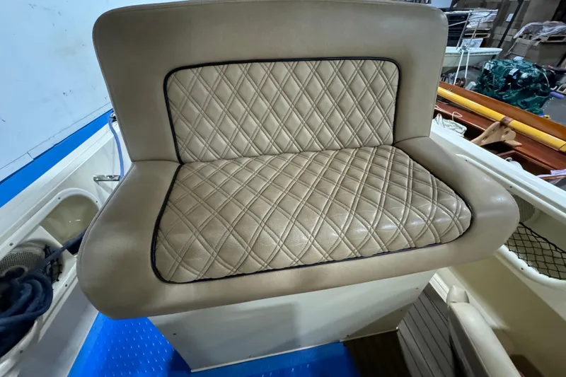 Slide: The Image of 2020 Vanquish Runabout boat seat with diamond-stitched beige upholstery. - 10