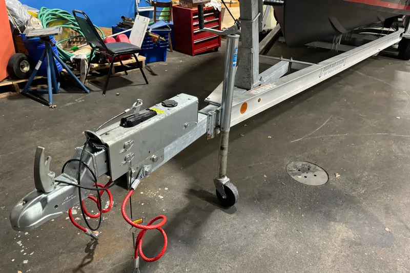 Slide: The Image of Trailer hitch of a 2020 Vanquish Runabout in a garage setting. - 3