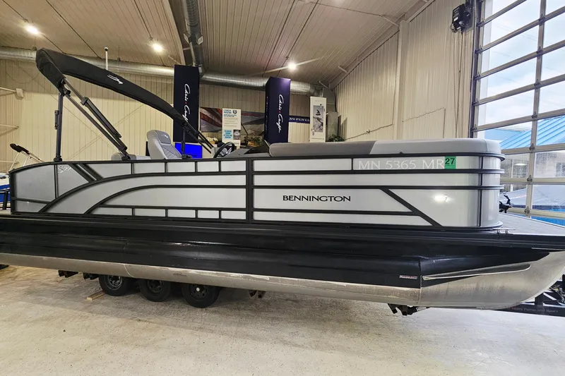 The Image of 2024 Bennington 22 S Swingback pontoon boat displayed indoors. - 1
