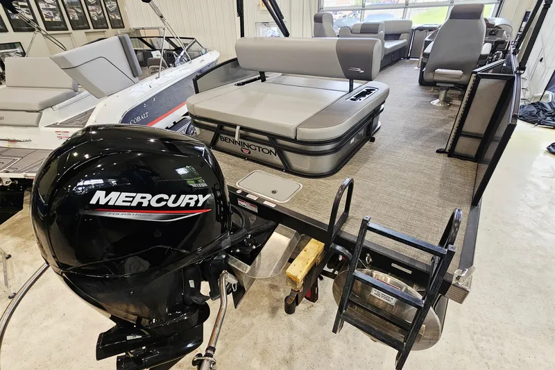 Slide: The Image of 2024 Bennington 22 S Swingback pontoon boat with Mercury engine in showroom. - 5