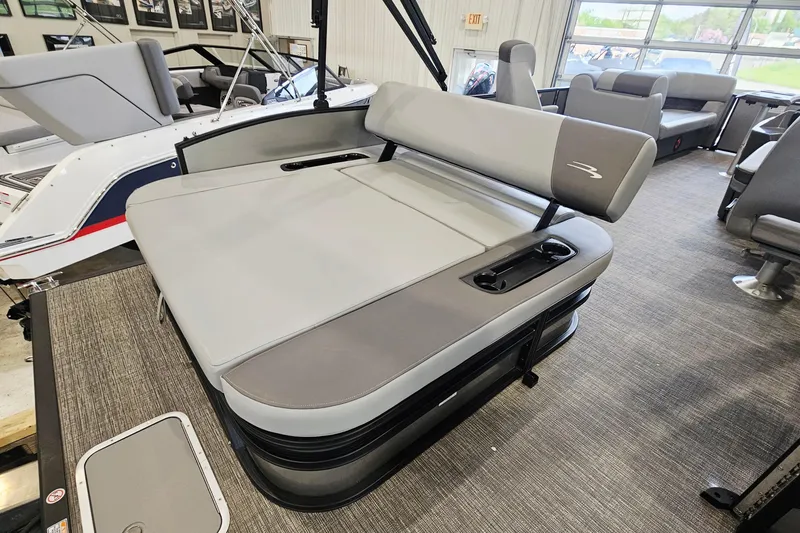 Slide: The Image of 2024 Bennington 22 S Swingback boat interior with gray seating and modern design. - 6