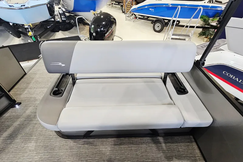 Slide: The Image of 2024 Bennington 22 S Swingback boat seat with cup holders in showroom. - 8