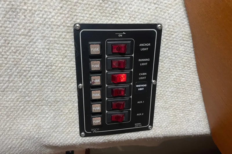 Slide: The Image of Control panel with labeled switches and fuses on a Precision 23, 2001 model. - 19