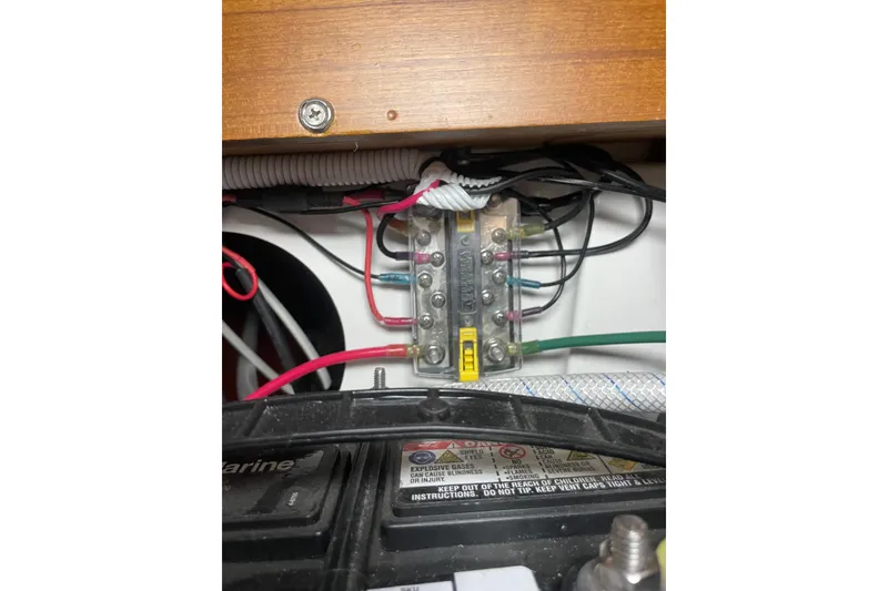 Slide: The Image of Electrical wiring and fuse box inside a Precision 23 boat, model year 2001. - 25