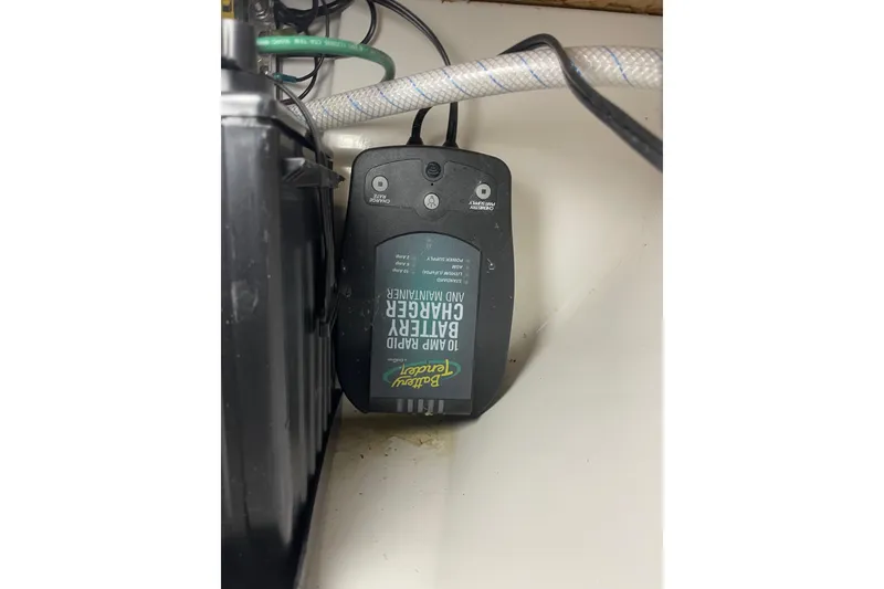 Slide: The Image of Battery charger and maintainer, Precision 23 model, 2001, connected with cables. - 27