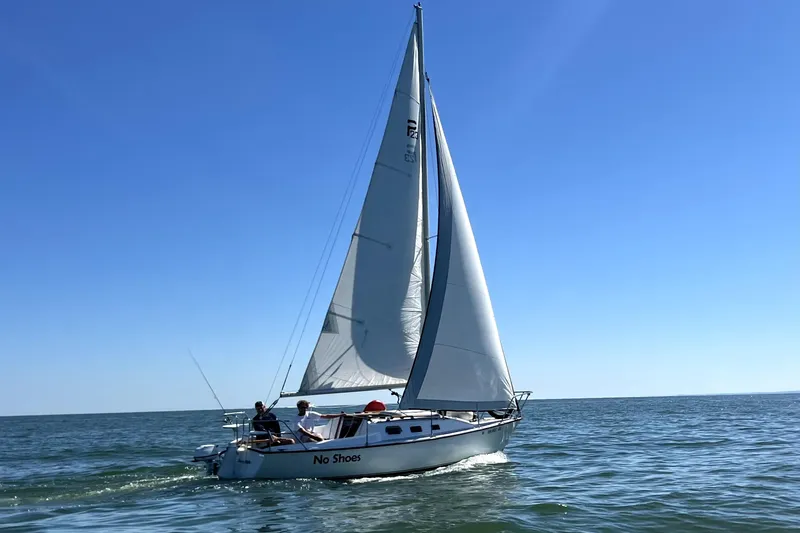 Slide: The Image of Sailboat "No Shoes" on open water, Precision 23 model, 2001, under clear blue sky. - 3