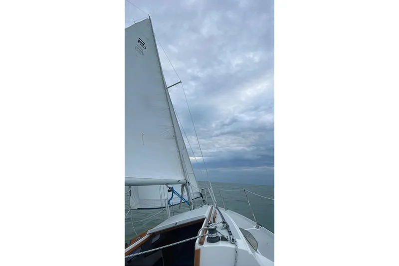 Slide: The Image of Sailing on a 2001 Precision 23 boat under cloudy skies. - 30