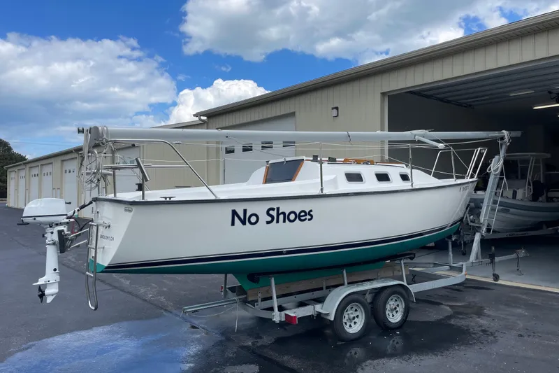 Slide: The Image of Sailboat "No Shoes" on trailer, Precision 23 model, 2001, parked outside a garage. - 34