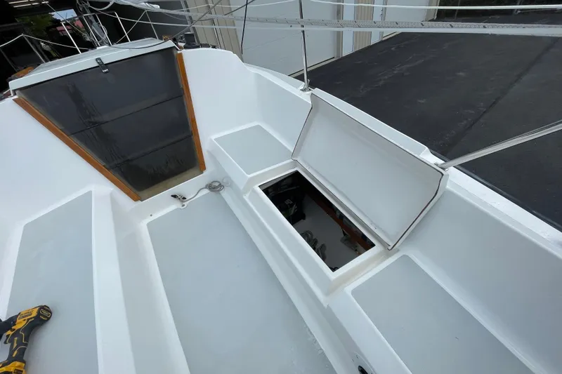 Slide: The Image of Open cockpit of a 2001 Precision 23 sailboat with storage compartment. - 41