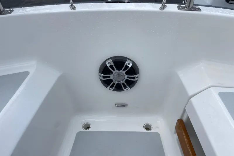 Slide: The Image of Cockpit of 2001 Precision 23 sailboat featuring a mounted speaker. - 43